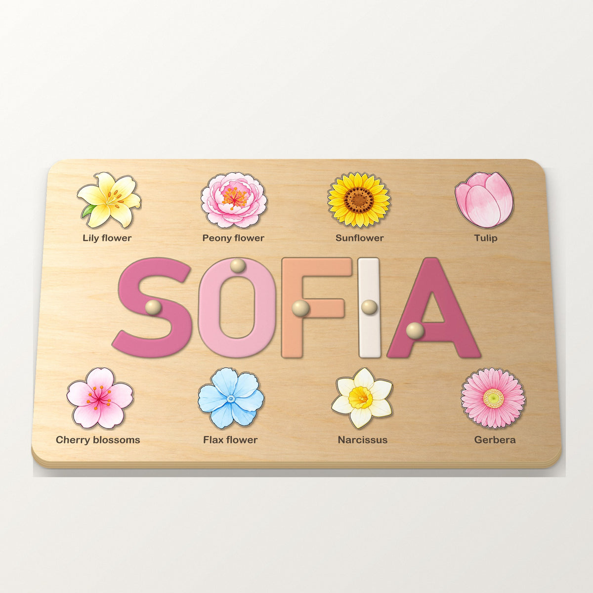 Rosa namnpussel med blommor och namnet SOFIA